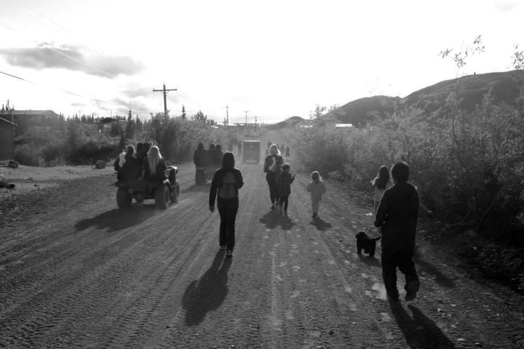 People heading to the Gwich'in Gathering along the main road in Arctic Village / Photo by Susan Culliney